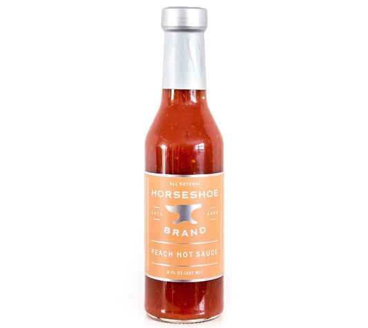 Peach Hot Sauce von Horseshoe Brand kaufen | Süß-saftige Pfirsich trifft feurige Serrano-Chilis | Ideal für vielfältige Gerichte