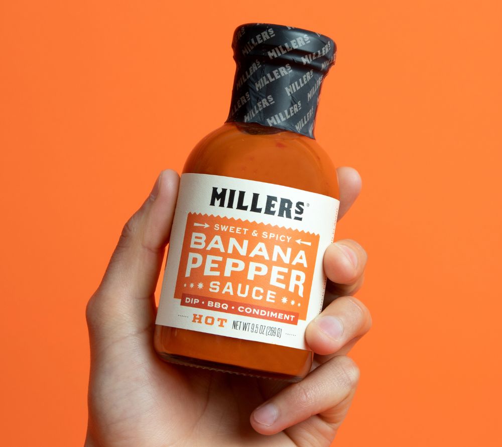 Banana Pepper Hot Sauce von Miller’s kaufen – original US-Sauce mit süß-scharfem Geschmack & Scovie™-Auszeichnung. Ideal für Burger, BBQ, Käse & Geschenke.